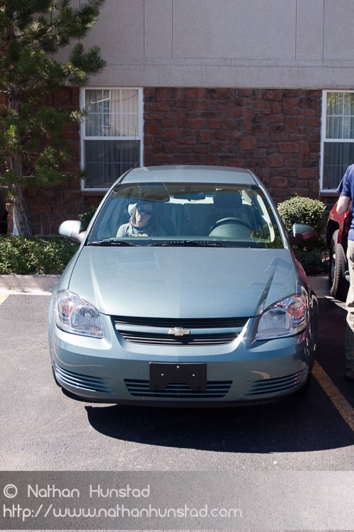 Julia Miller in our awesome rental car, the Chevy Cobalt. So new it didn't even have plates!